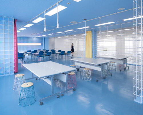 organic design architecture studio uses steel bars to divide free office space in tokyo