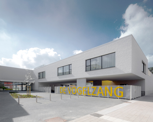 planomatic integrates volumetric primary school into belgian urban fabric