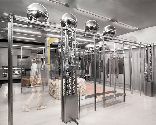 sò studio designs PEU À PEU sports store with large moving spheres in china