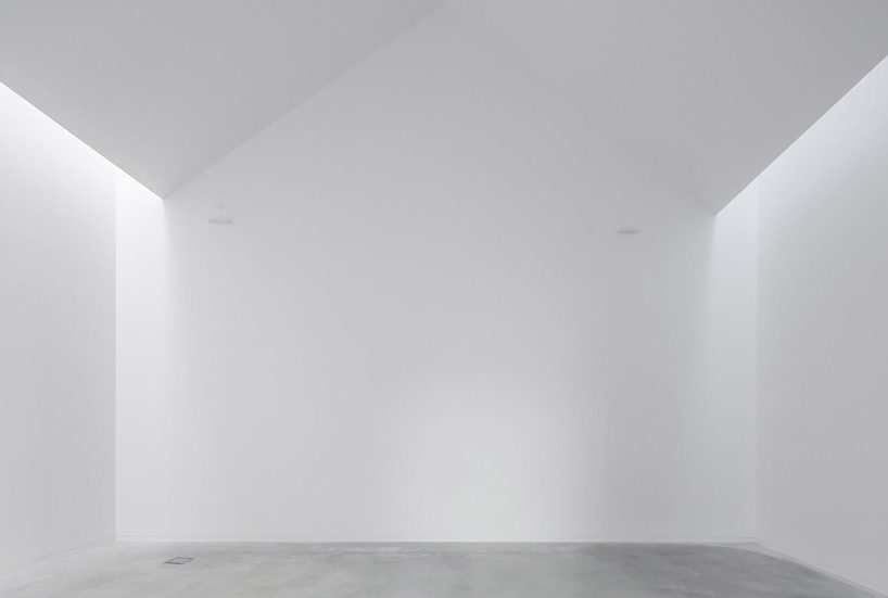 spaceworkers joins varying concrete volumes for romanesque exhibition building in portugal