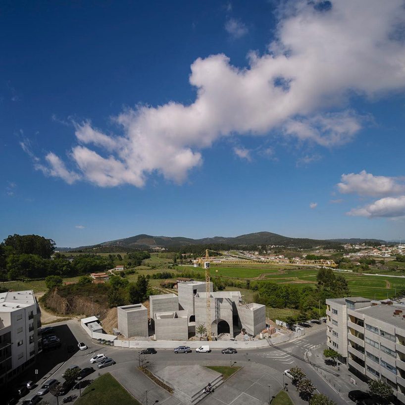 spaceworkers joins varying concrete volumes for romanesque exhibition building in portugal