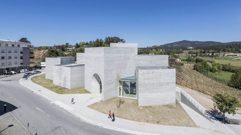spaceworkers joins varying concrete volumes for romanesque exhibition building in portugal