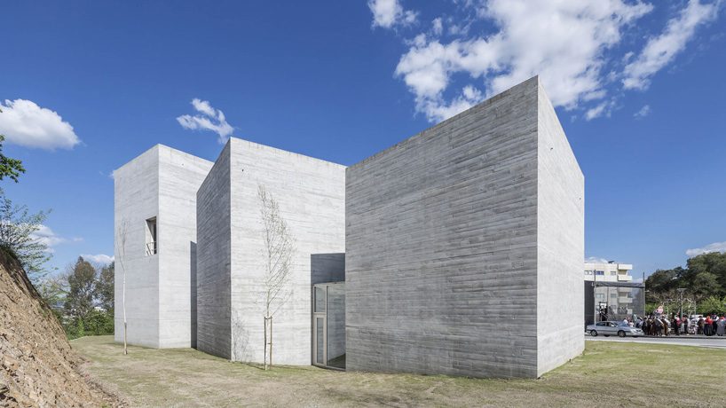 spaceworkers joins varying concrete volumes for romanesque exhibition building in portugal
