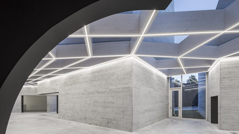 spaceworkers joins varying concrete volumes for romanesque exhibition building in portugal