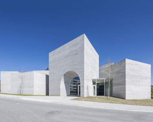 spaceworkers joins varying concrete volumes for romanesque exhibition building in portugal