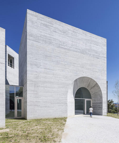 spaceworkers joins varying concrete volumes for romanesque exhibition building in portugal