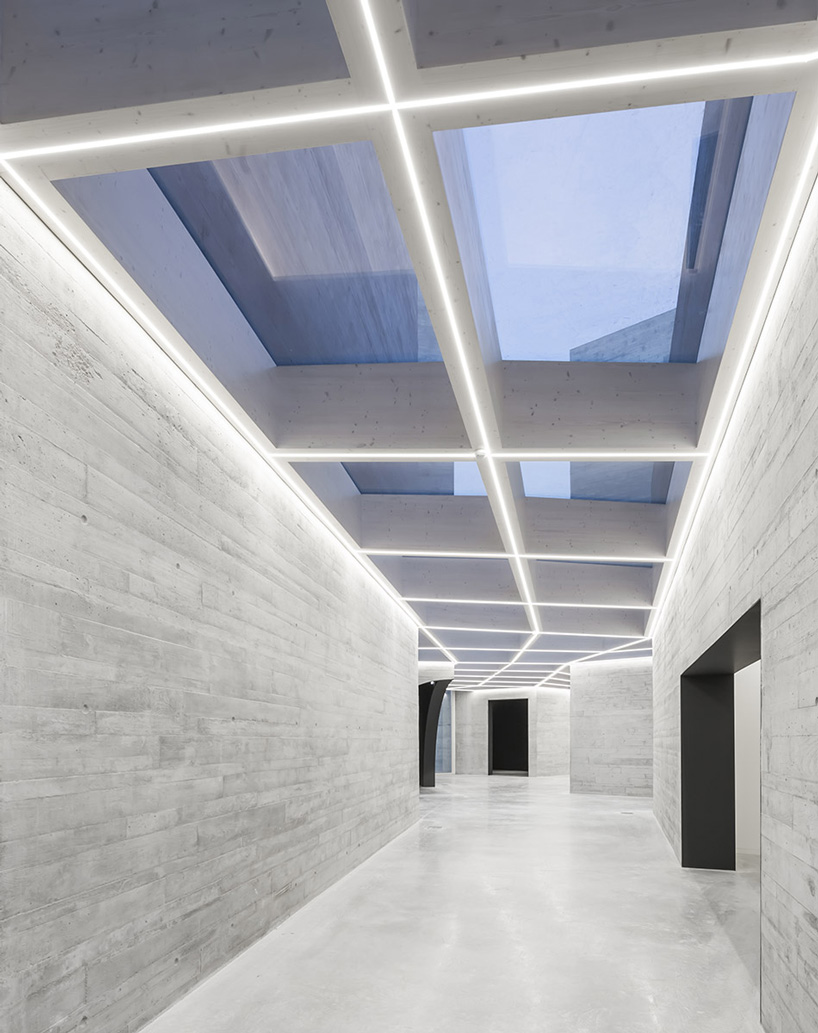 spaceworkers joins varying concrete volumes for romanesque exhibition building in portugal