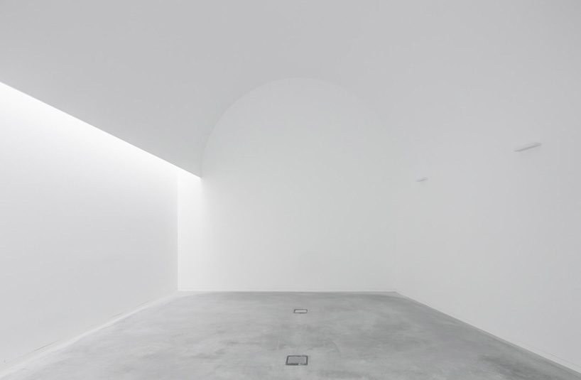 spaceworkers joins varying concrete volumes for romanesque exhibition building in portugal