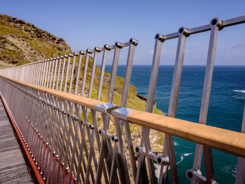 tintagel footbridge reunites historic cornwall castle for the first time in 500 years