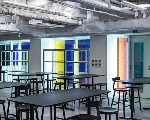 tsubame architects divides panasonic's future life factory with colorful wall of metal + neon