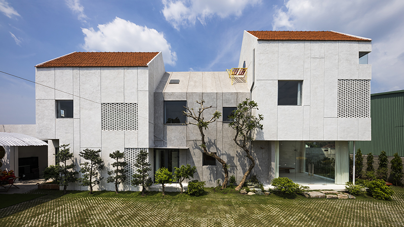 time architects builds vietnam house for 3 families with open living spaces