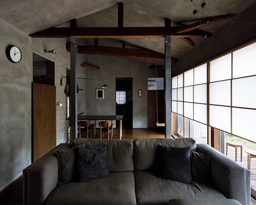 wooden panels and warm grey characterize 1110's house and office renovation in osaka