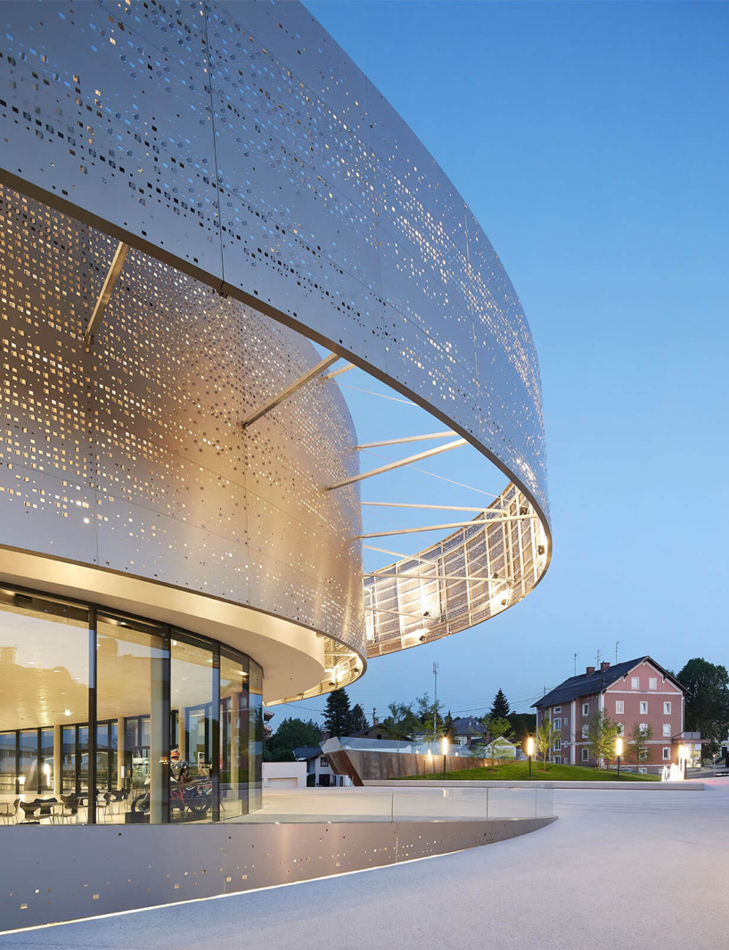 x architekten envelops KTM motohall in a sweeping dynamic facade in austria