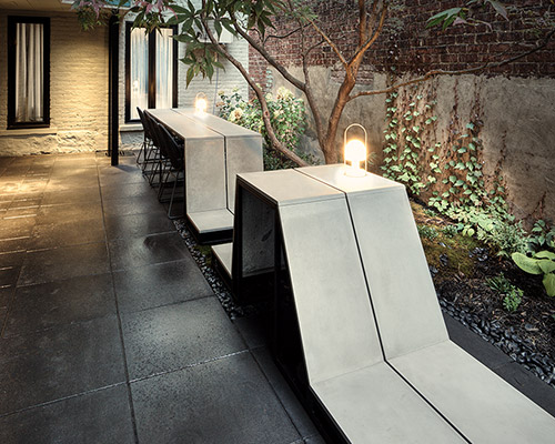 MYTO unfolds concrete furniture for inner courtyard in montreal, canada