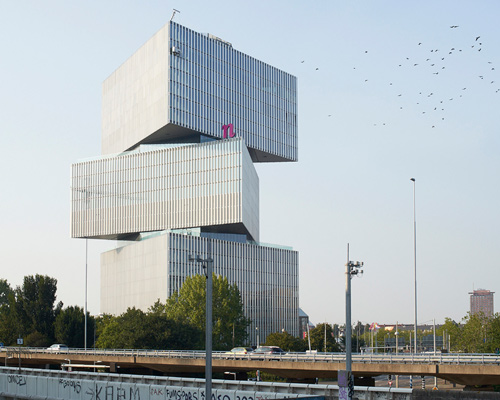 triangular volumes of OMA's nearly complete amsterdam hotel documented by nils koenning