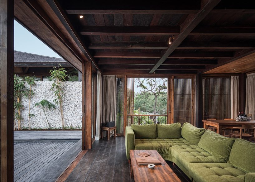  alexis dornier builds house in bali with reused timber + façade of movable screens