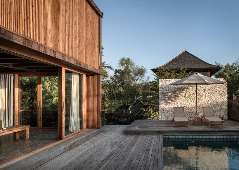  alexis dornier builds house in bali with reused timber + façade of movable screens