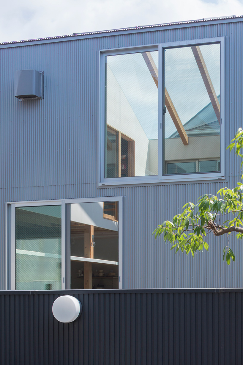 tato architects builds house in tsukimiyama, japan, around covered courtyard