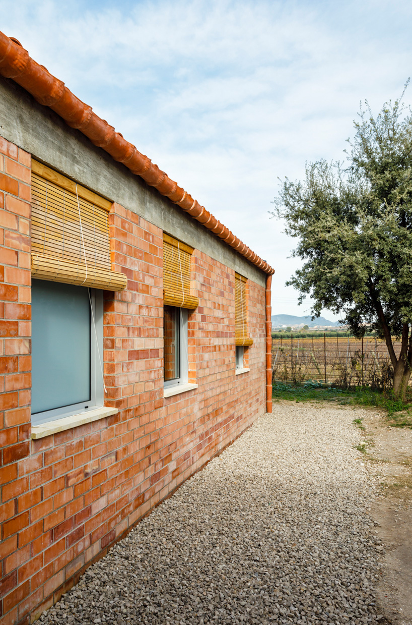  jesús perales builds casa almudena as an asymmetrical brick residence in spain