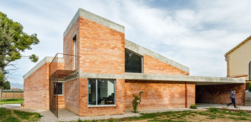  jesús perales builds casa almudena as an asymmetrical brick residence in spain