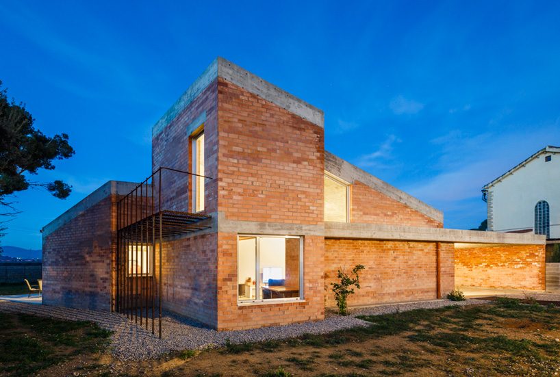 jesús perales builds casa almudena as an asymmetrical brick residence in spain