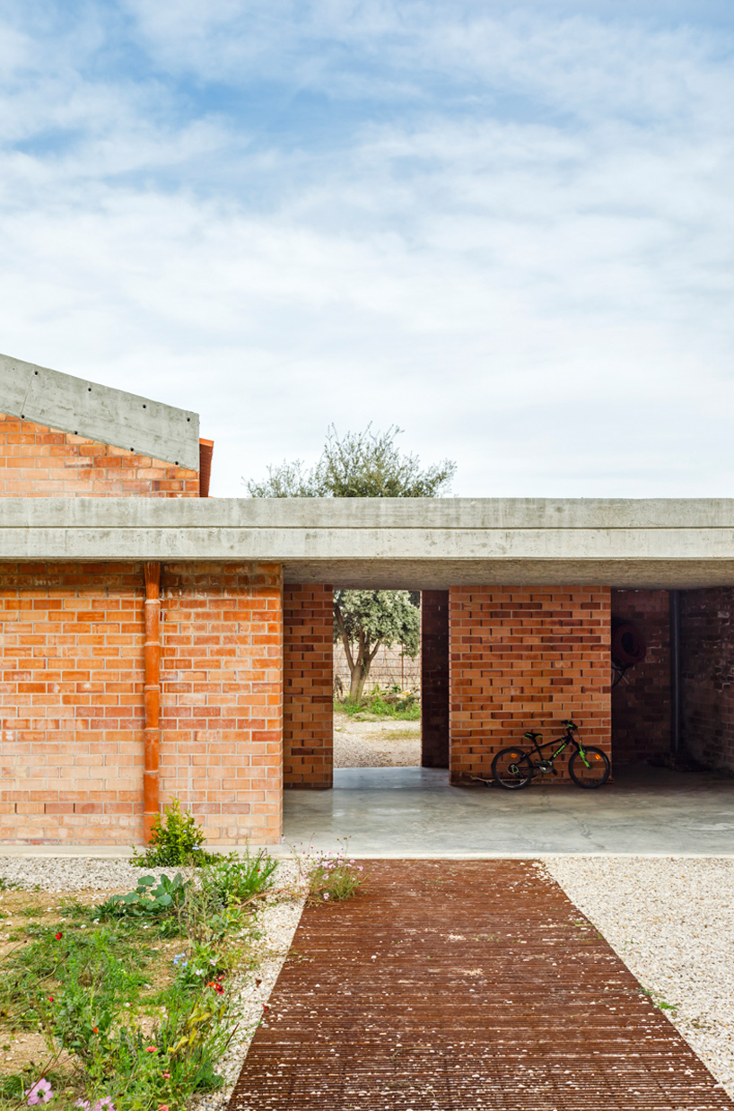 jesús perales builds casa almudena as an asymmetrical brick residence in spain