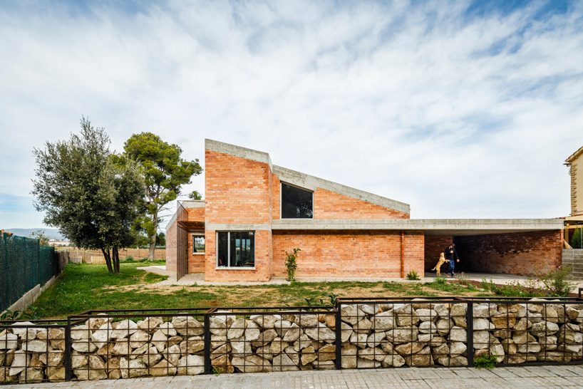  jesús perales builds casa almudena as an asymmetrical brick residence in spain