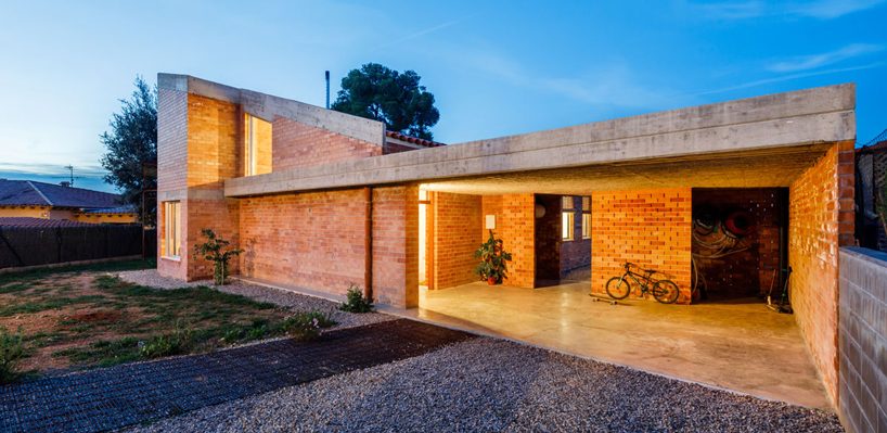 jesús perales builds asymmetrical brick + concrete family residence in spain