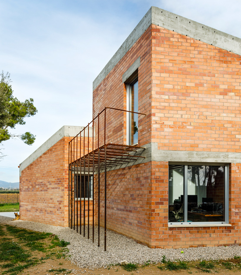  jesús perales builds casa almudena as an asymmetrical brick residence in spain