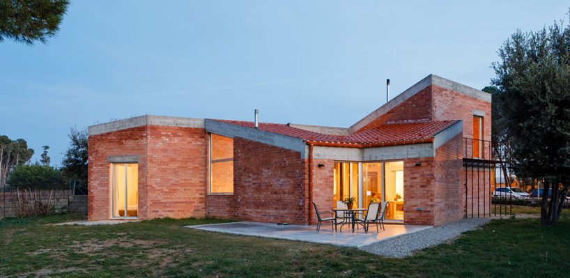  jesús perales builds asymmetrical brick + concrete family residence in spain