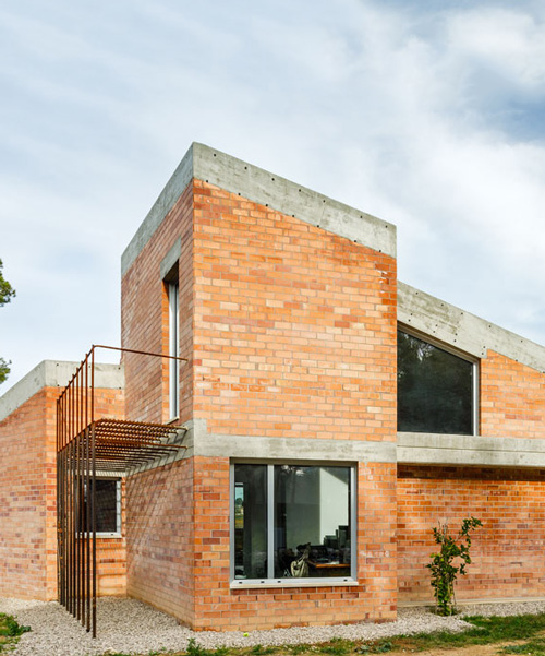 jesús perales builds casa almudena as an asymmetrical brick residence in spain