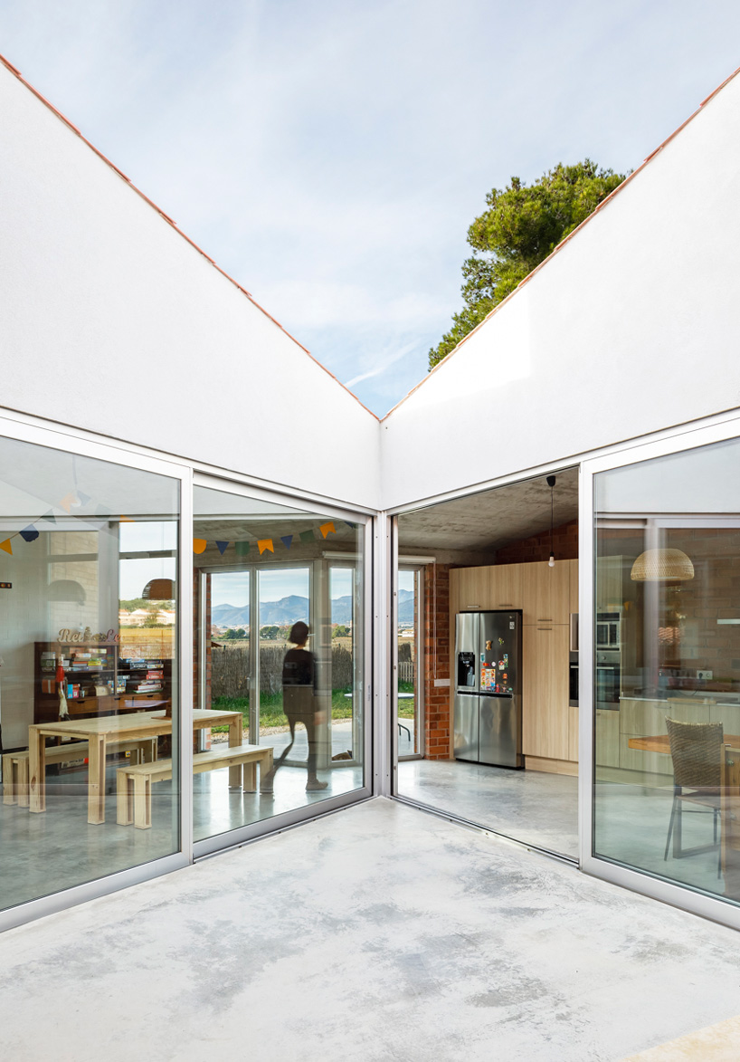 jesús perales builds casa almudena as an asymmetrical brick residence in spain