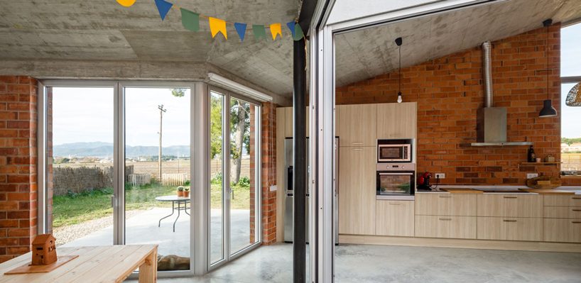  jesús perales builds asymmetrical brick + concrete family residence in spain