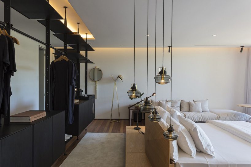 jobim carlevaro arquitetos finishes hotel suite in brazil with movable façade of wooden slats