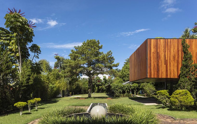 jobim carlevaro arquitetos finishes hotel suite in brazil with movable façade of wooden slats