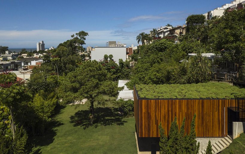 jobim carlevaro arquitetos finishes hotel suite in brazil with movable façade of wooden slats