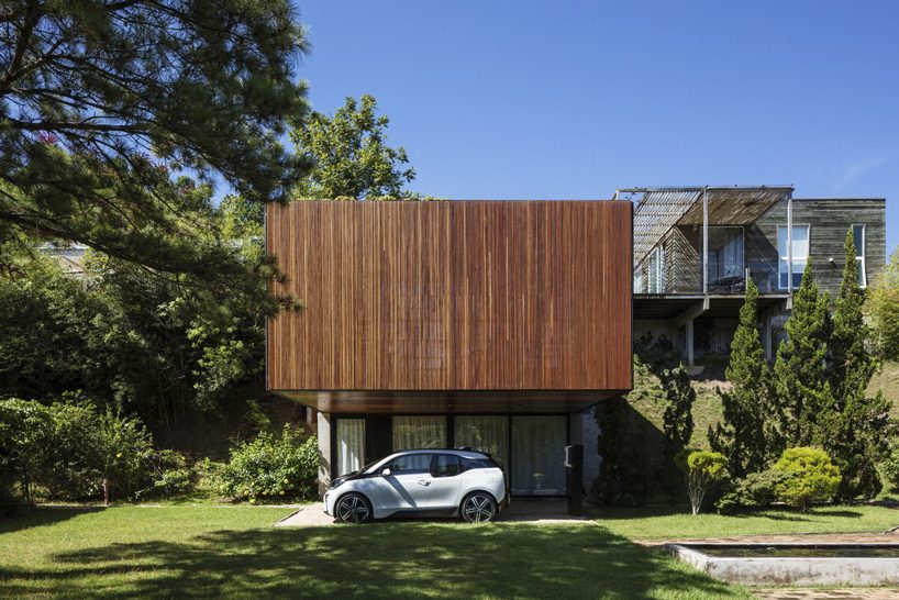 jobim carlevaro arquitetos finishes hotel suite in brazil with movable façade of wooden slats