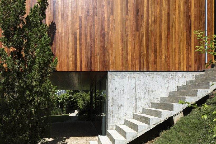 jobim carlevaro arquitetos finishes hotel suite in brazil with movable façade of wooden slats