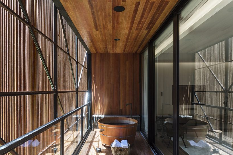 jobim carlevaro arquitetos finishes hotel suite in brazil with movable façade of wooden slats
