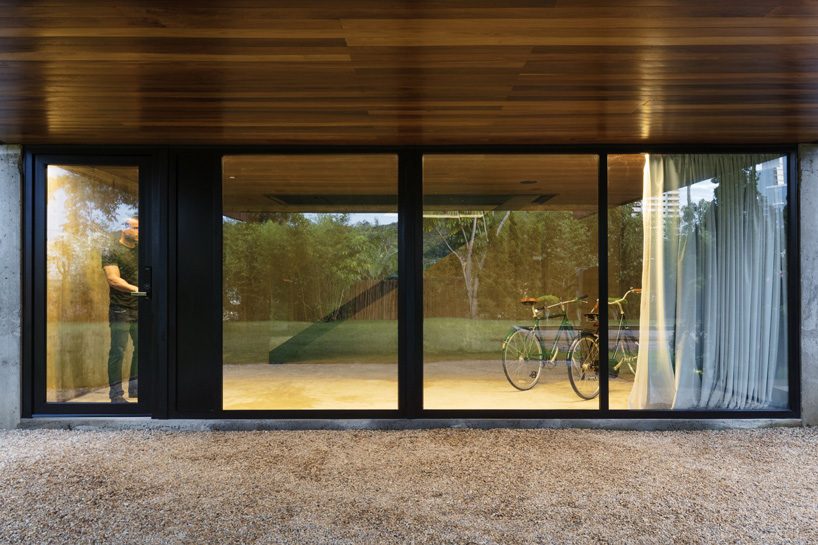 jobim carlevaro arquitetos finishes hotel suite in brazil with movable façade of wooden slats