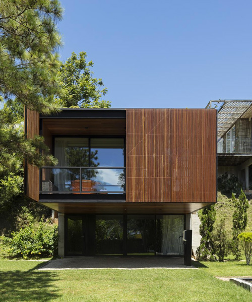 jobim carlevaro arquitetos finishes hotel suite in brazil with movable façade of wooden slats