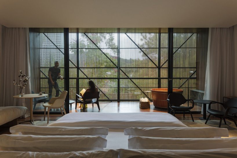 jobim carlevaro arquitetos finishes hotel suite in brazil with movable façade of wooden slats