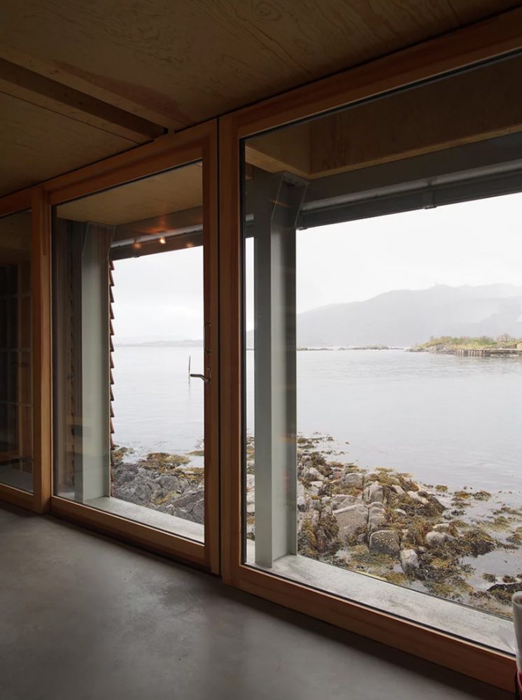 knut hjeltnes builds timber weekend house on a norwegian islet of its own