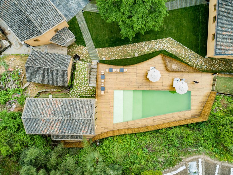 kooo architects rebuilds 'origin villa' hotel in rural china using bamboo, stone + charred wood