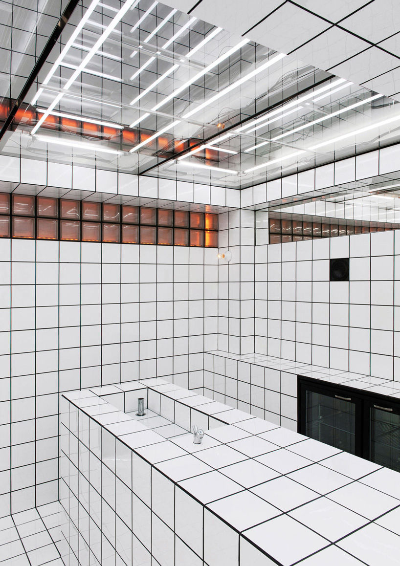 artist-designed LAX bar is built as a walk-in social sculpture of ceramic tiles, mirrors + neon