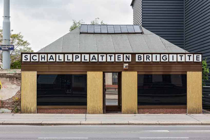  artist-designed LAX bar is built as a walk-in social sculpture of ceramic tiles, mirrors + neon
