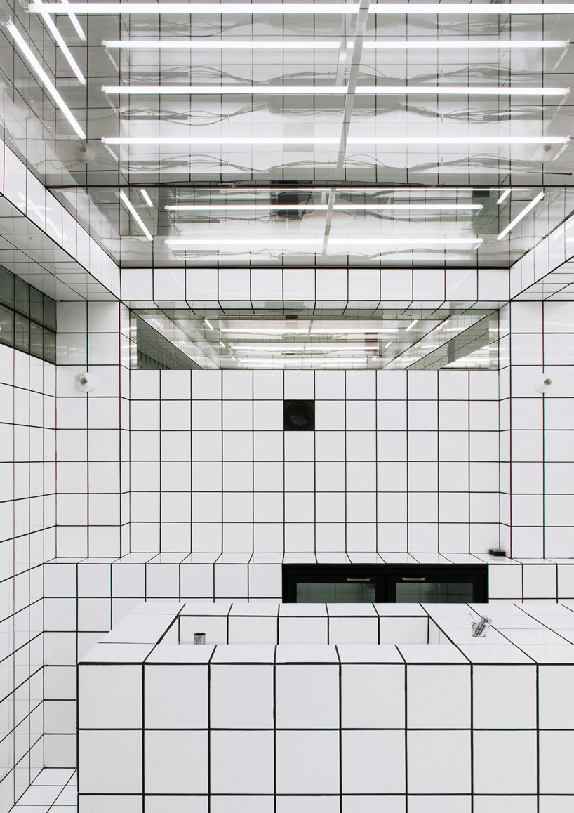 artist-designed LAX bar is built as a walk-in social sculpture of ceramic tiles, mirrors + neon