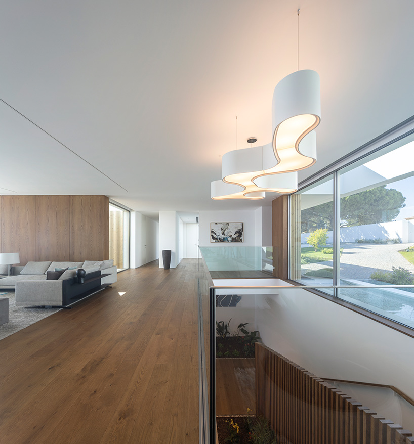 lux mare houses by mário martins are 'two autonomous pieces that complement one another'