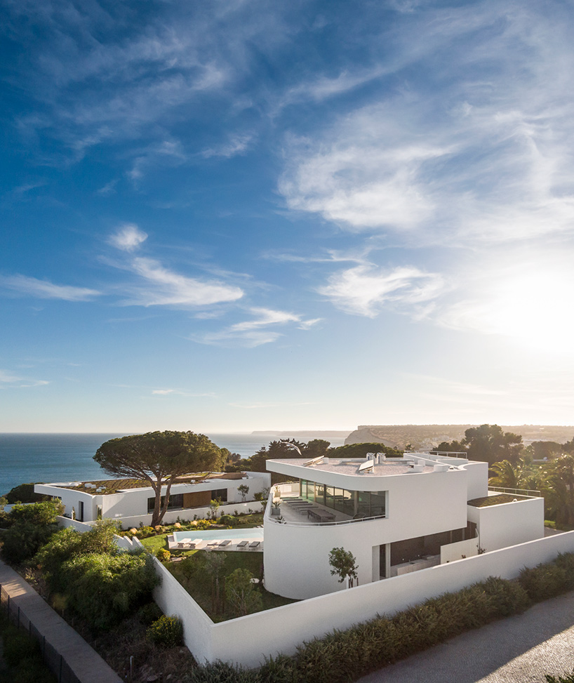 lux mare houses by mário martins are 'two autonomous pieces that complement one another'