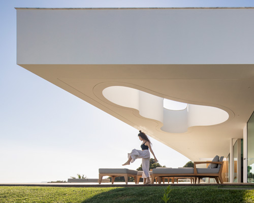 lux mare houses by mário martins are 'two autonomous pieces that complement one another'
